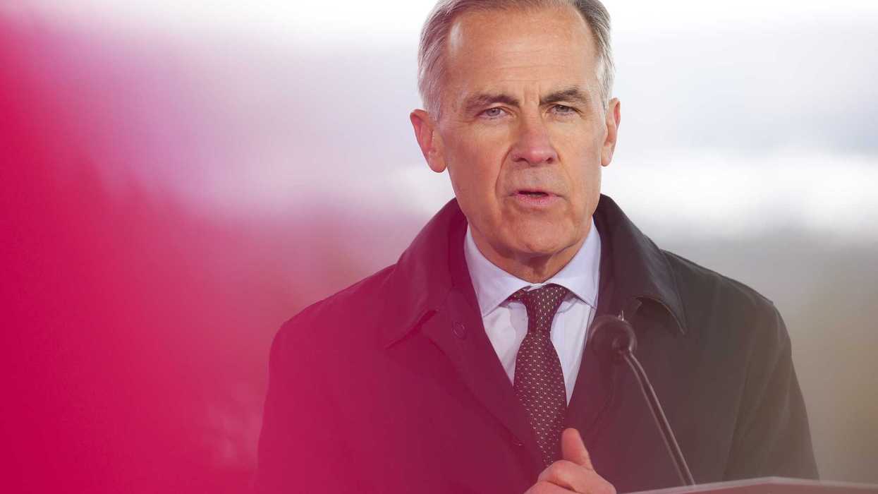Mark Carney speaks at a podium.