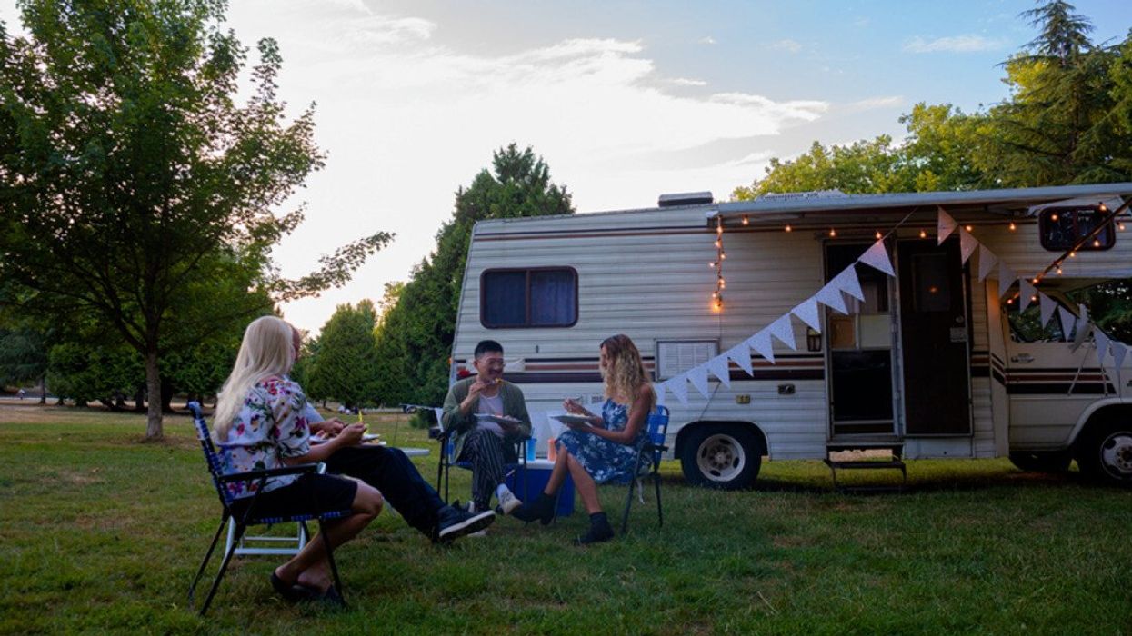 Max and friends relax outside his RV.