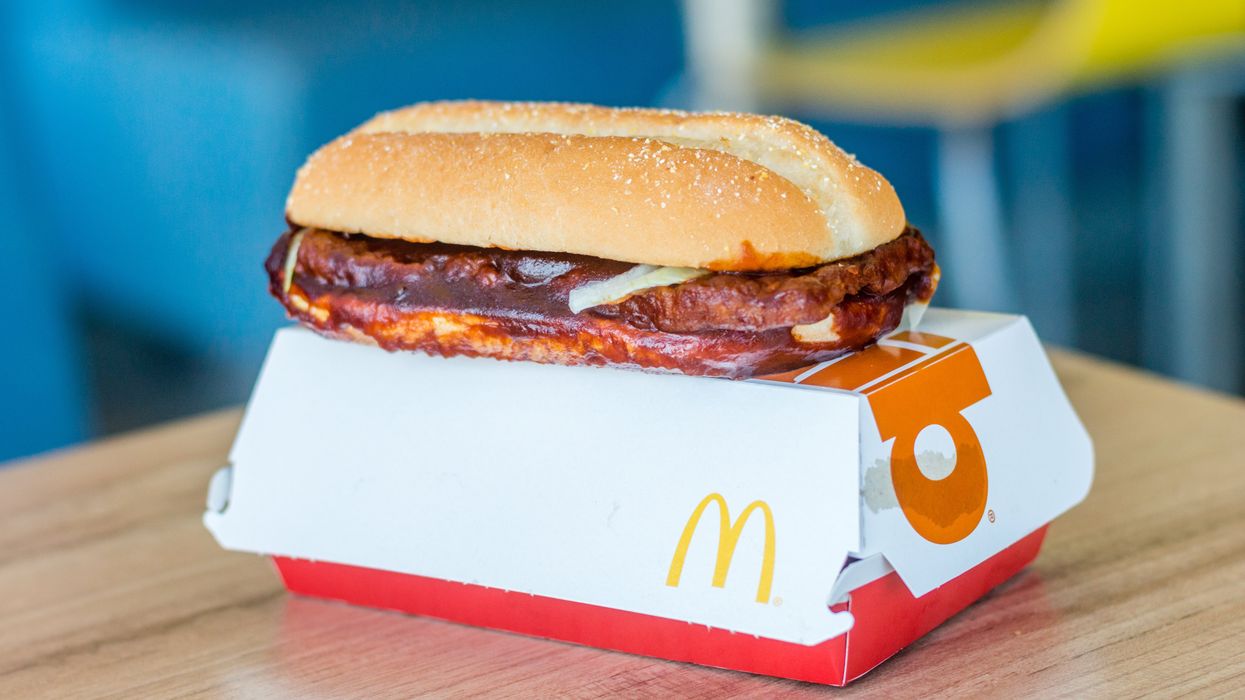 McDonald's McRib sandwich sitting on top of a box.