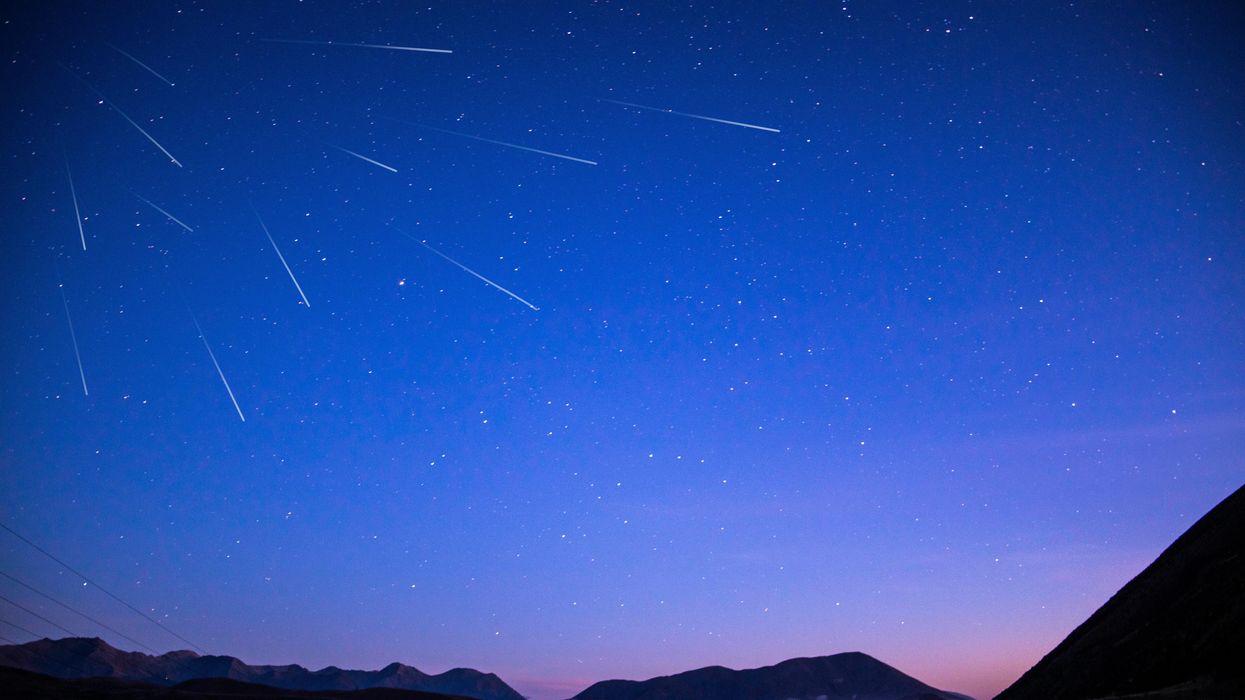 Meteors streaking across the sky during a meteor shower.