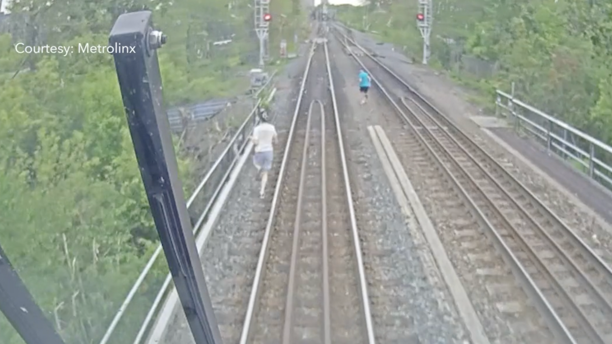 Metrolinx's video of the three people on the train tracks.