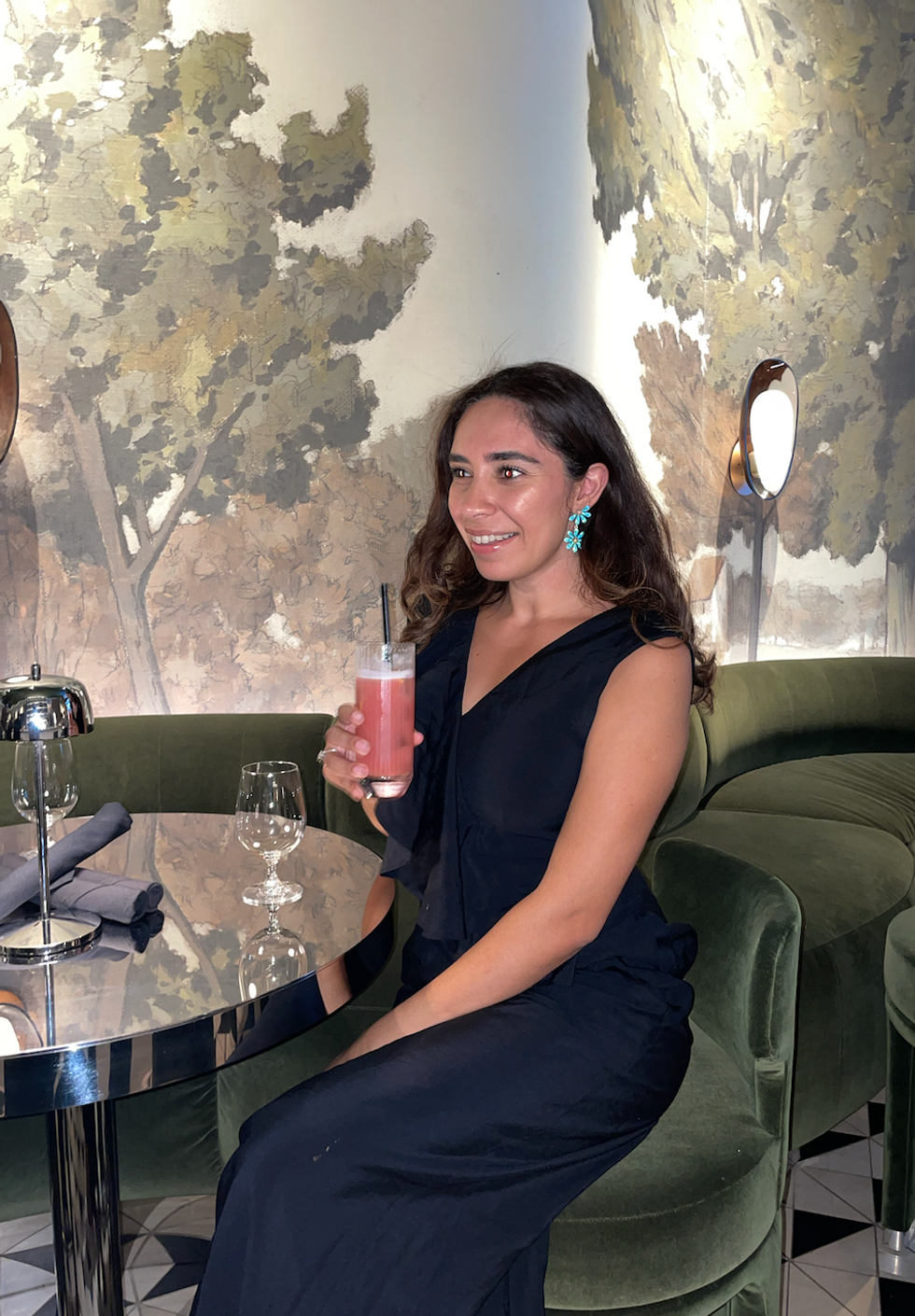 Mira drinking her mocktail.