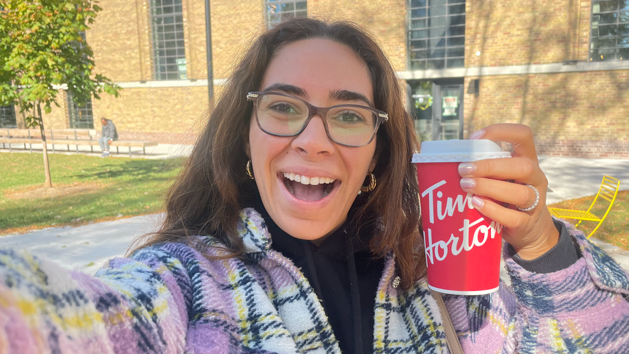 Mira Nabulsi holding her Tim Hortons double-double.
