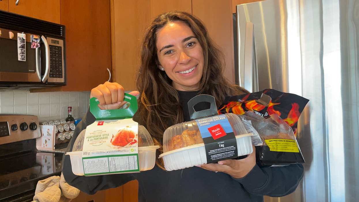 Mira Nabulsi holding three rotisserie chickens.