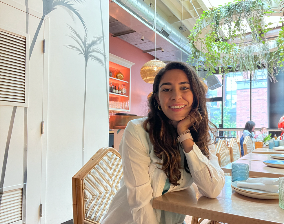 Mira Nabulsi sitting at Chubby's Jamaican Kitchen.