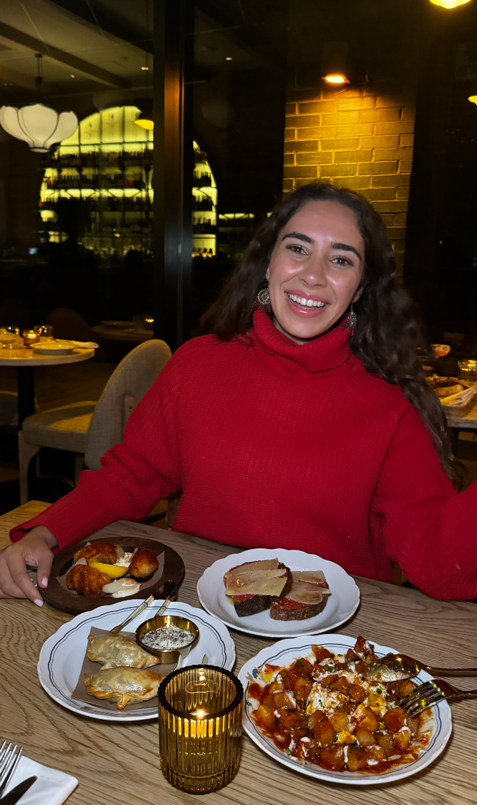Mira with four appetizers from Patria in Toronto.