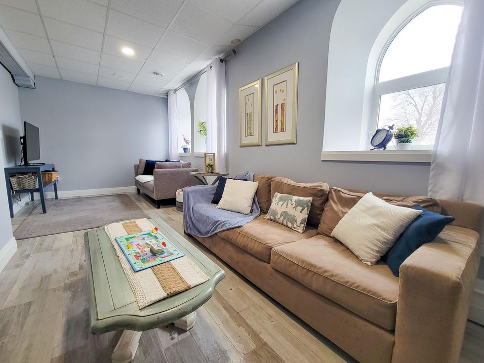 Modern renovation of living space with big bright windows.