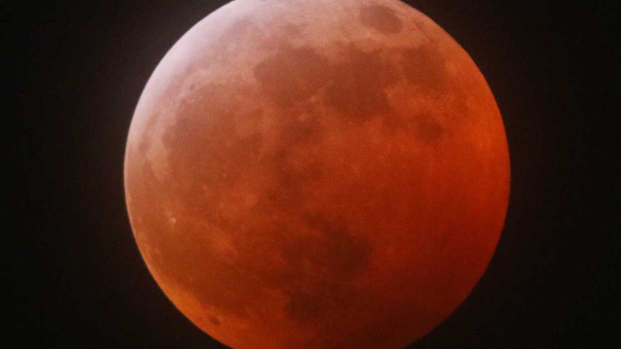 Moon shines red in a total lunar eclipse.