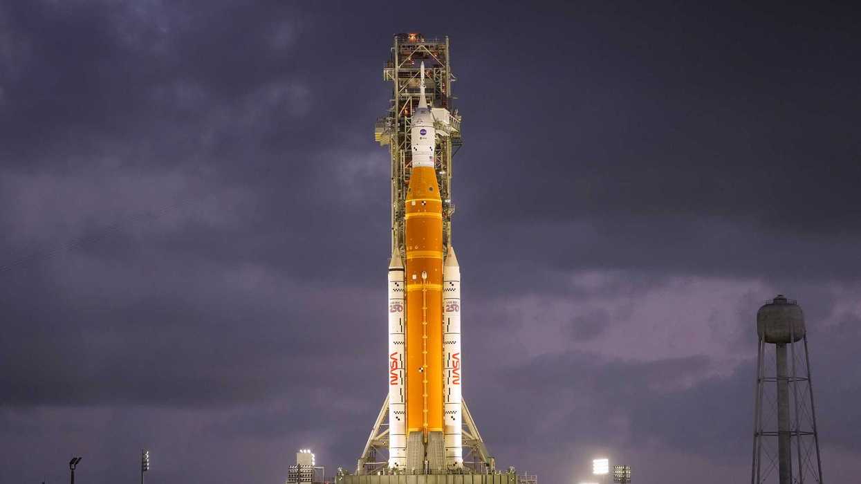 NASA's Artemis II moon rocket sits on a launch pad.