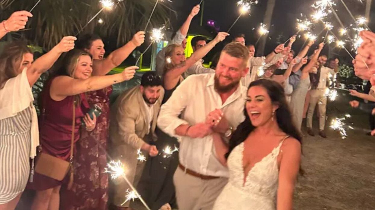Newlyweds Aric Hutchinson and Samantha Miller are shown at their wedding reception in South Carolina.