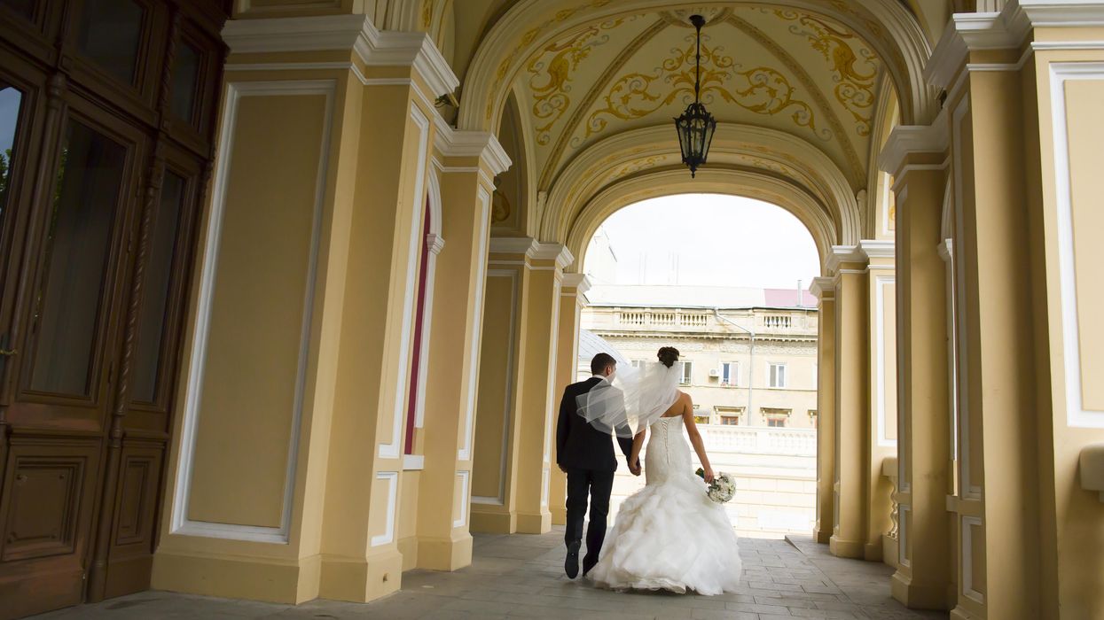 Newlyweds leaving a church.