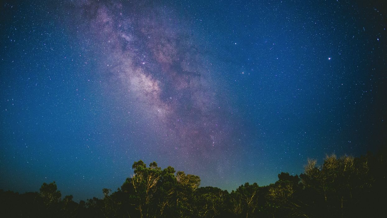 Night sky with the Milky Way, stars and planets.