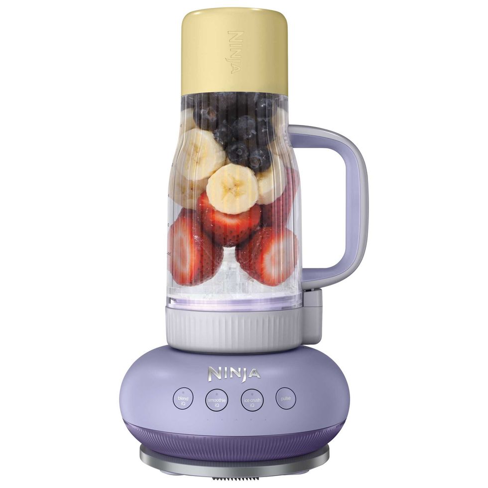Ninja portable blender filled with fresh fruit.