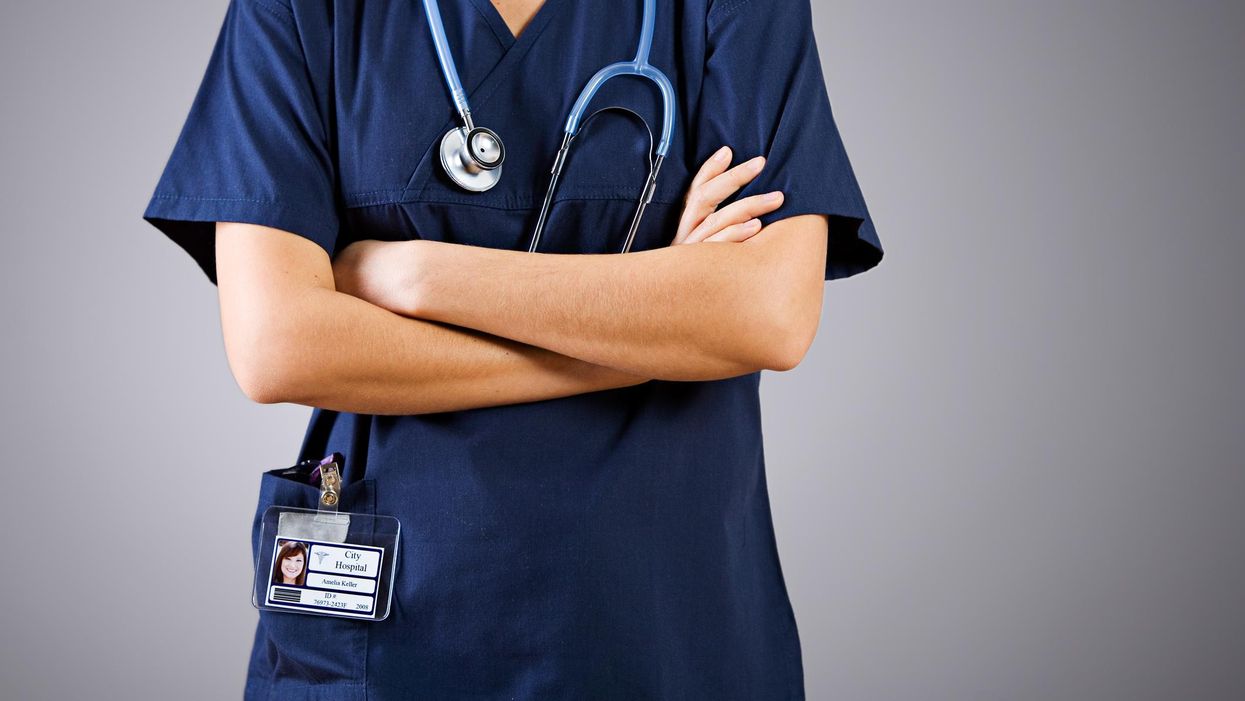 Nurse with their arms crossed.