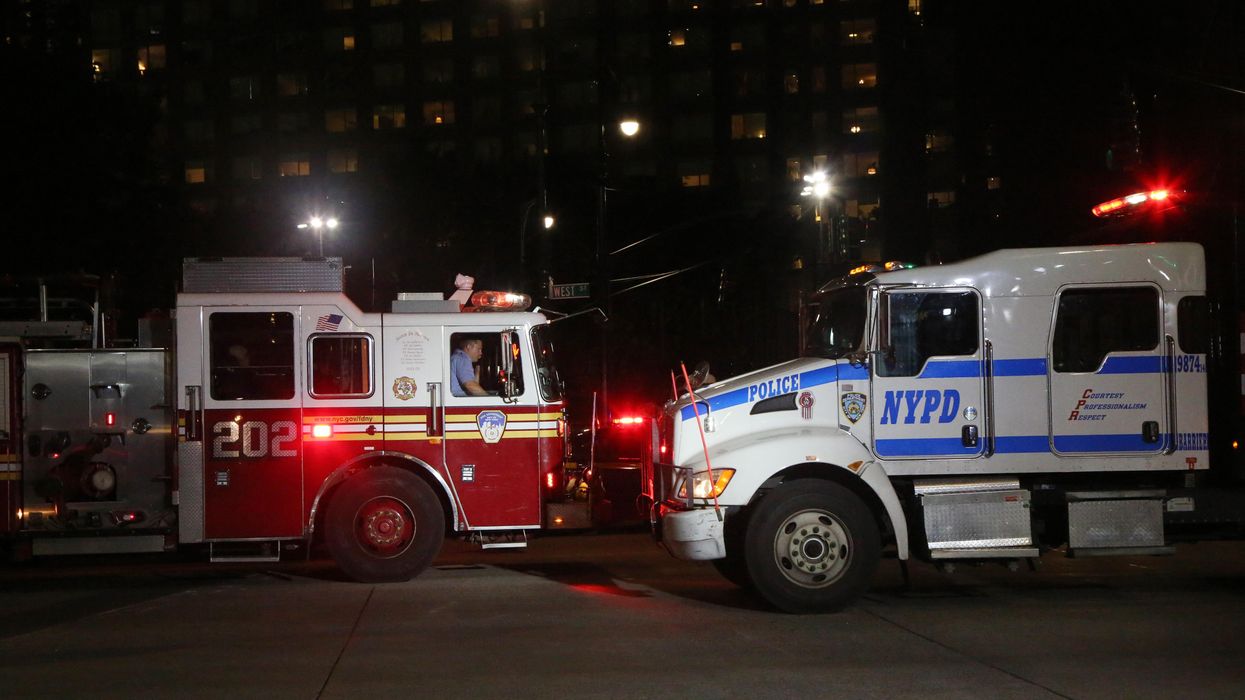 NYPD truck and FDNY firetruck at a crime scene.