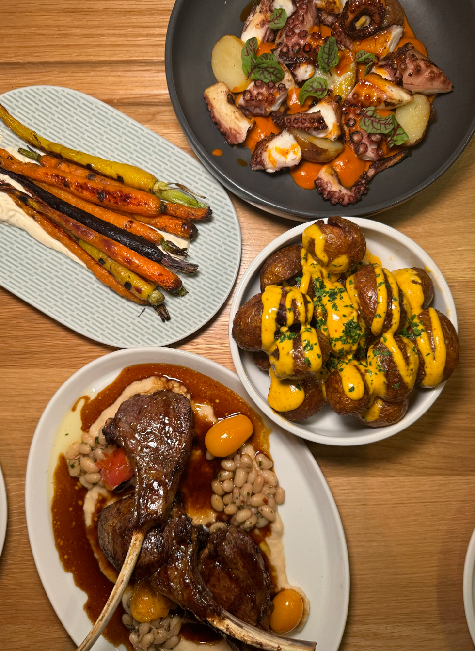 Octupus, Roasted Carrots, Patatas Bravas and Lamb Chops from Abrielle.