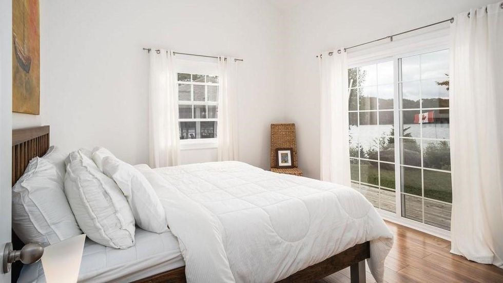 One of the bedrooms with a private balcony that overlooks the lake.