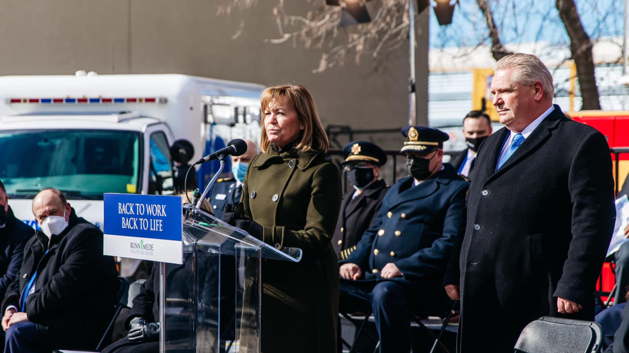 Ontario Health Minister Christine Elliott stands with Premier Doug Ford at a recent government announcement.