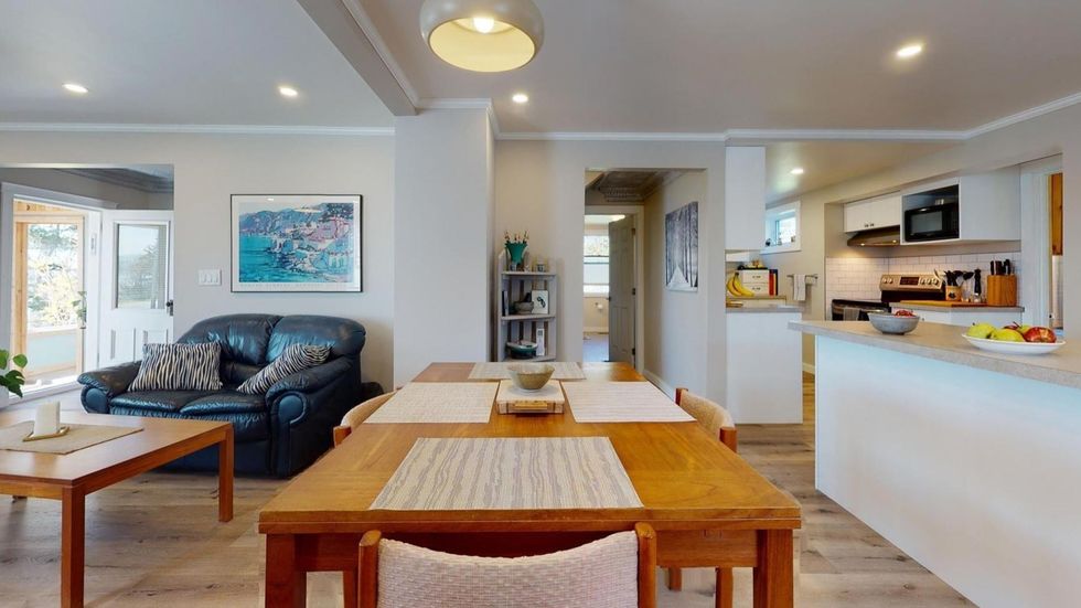 Open concept family room, dining area and kitchen.