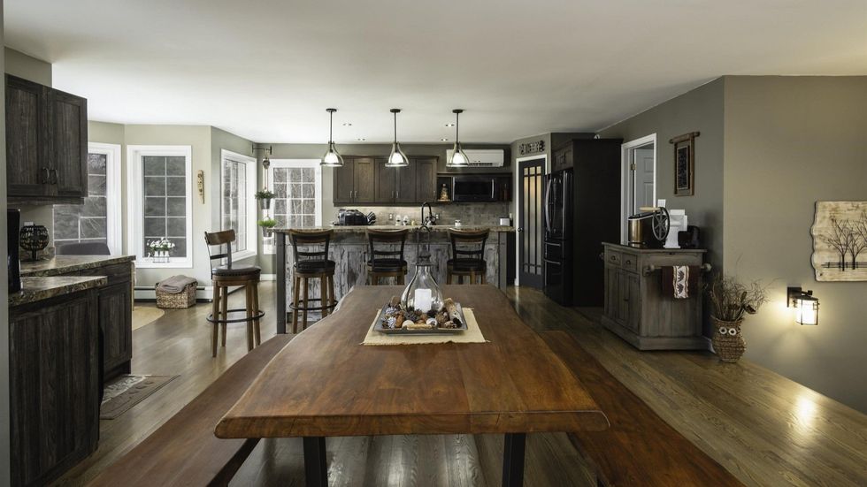 Open-concept kitchen and dining area in the house.
