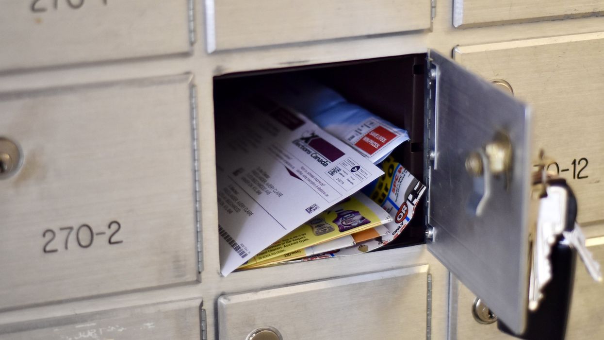 Open mailbox with Voter Information Card inside.