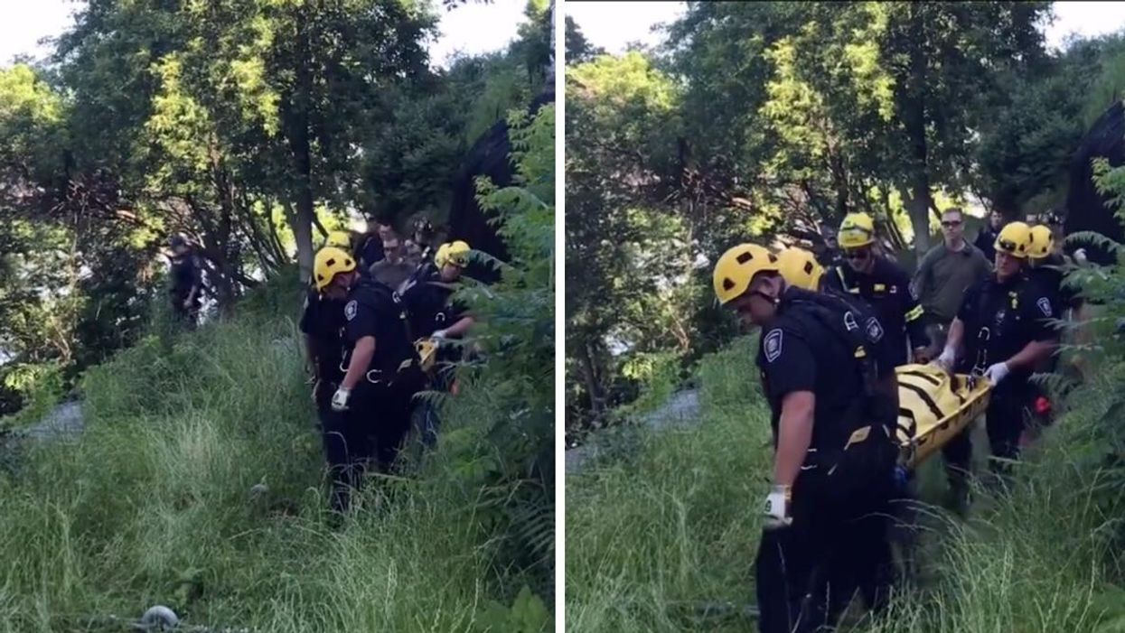 Ottawa Fire Services rescuing the individual who fell behind Parliament Hill.