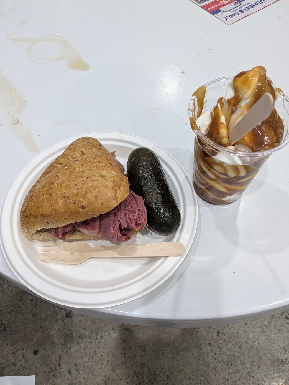Overhead image of a Costco Montreal smoked meat sandwich and a caramel sundae