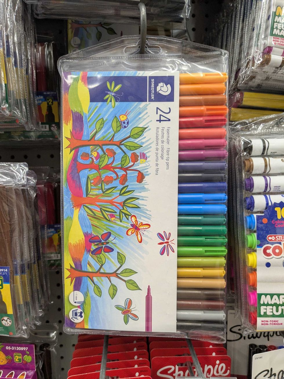 Package of colourful markers hanging on a shelf at Dollarama