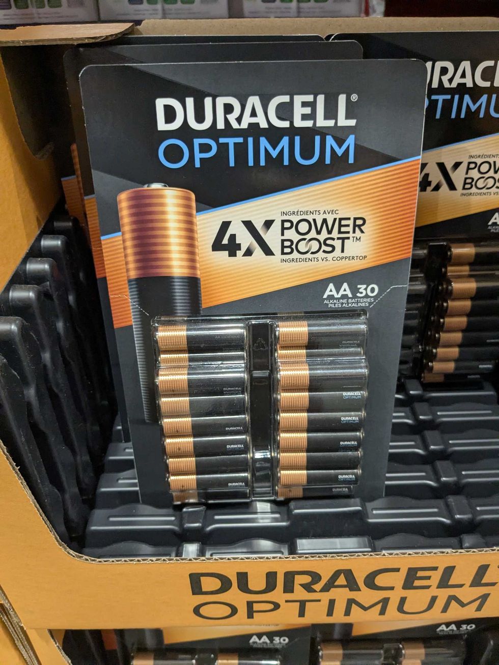 Package of Duracell AA batteries on a shelf