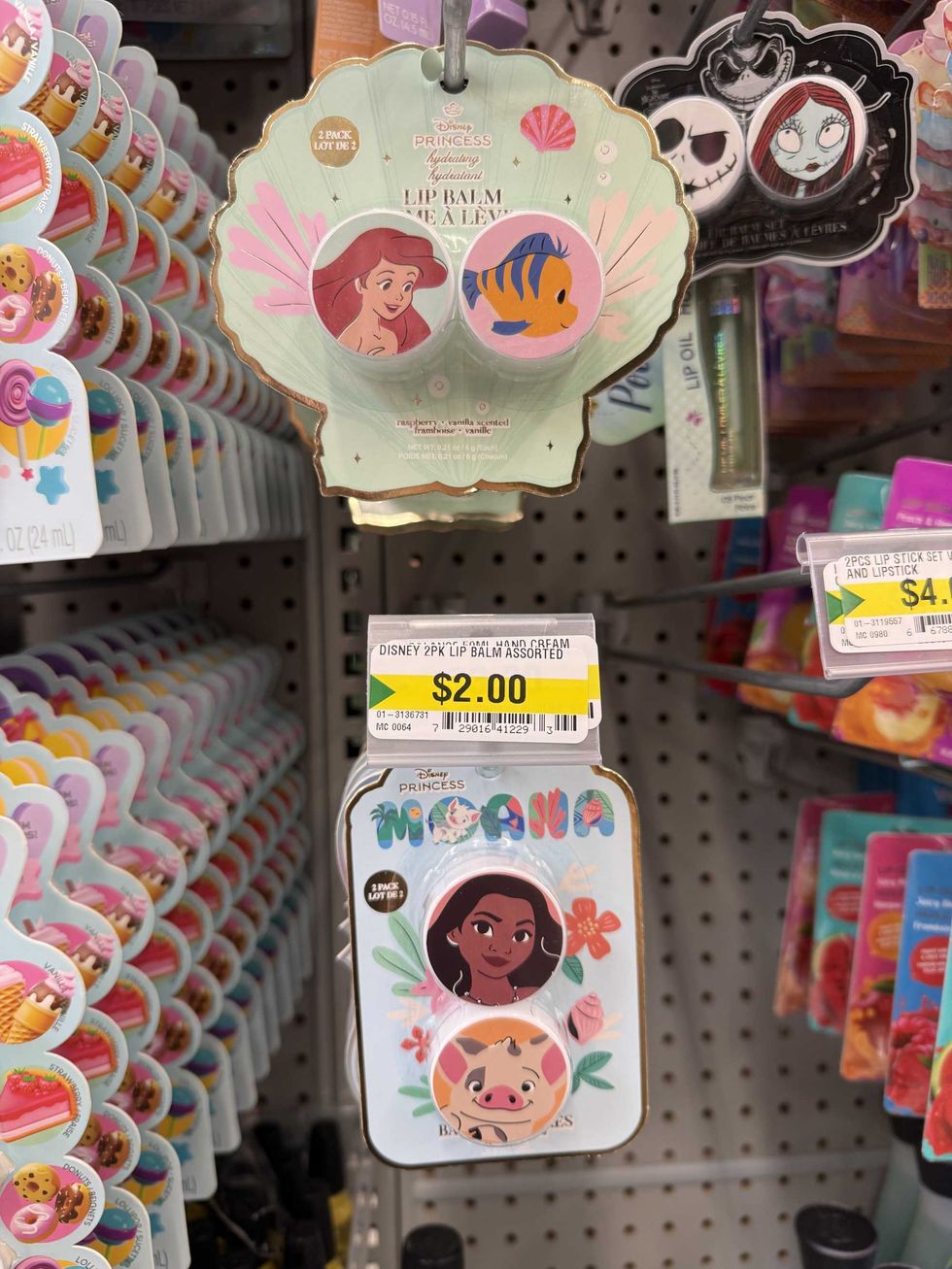 Packages of lip balms with photos of Disney princesses on the packaging.