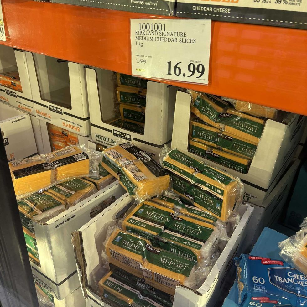 packs of Kirkland Signature medium cheddar cheese slices at costco