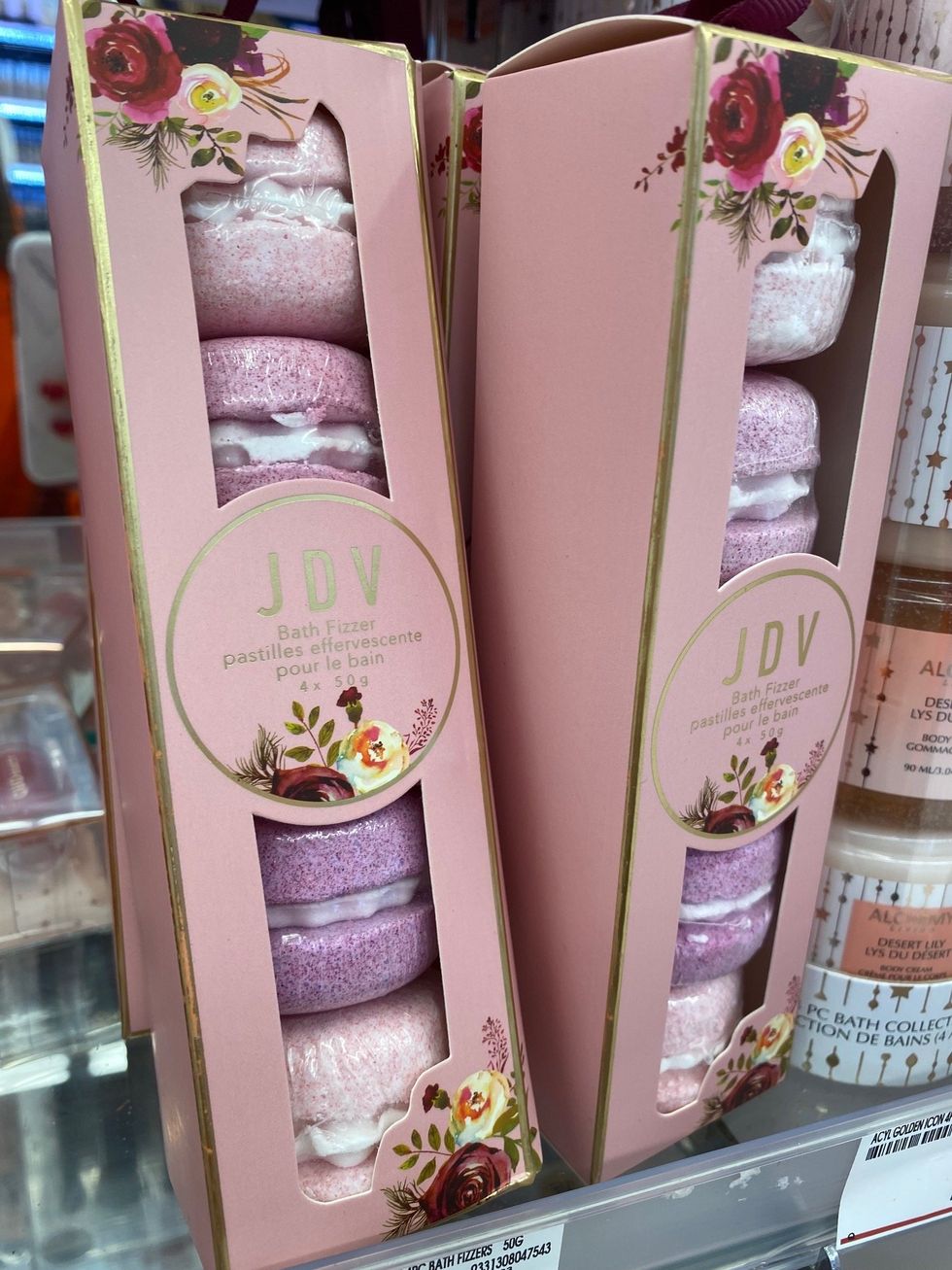 Packs of macaron shaped bath fizzers on the shelf at Shoppers Drug Mart.
