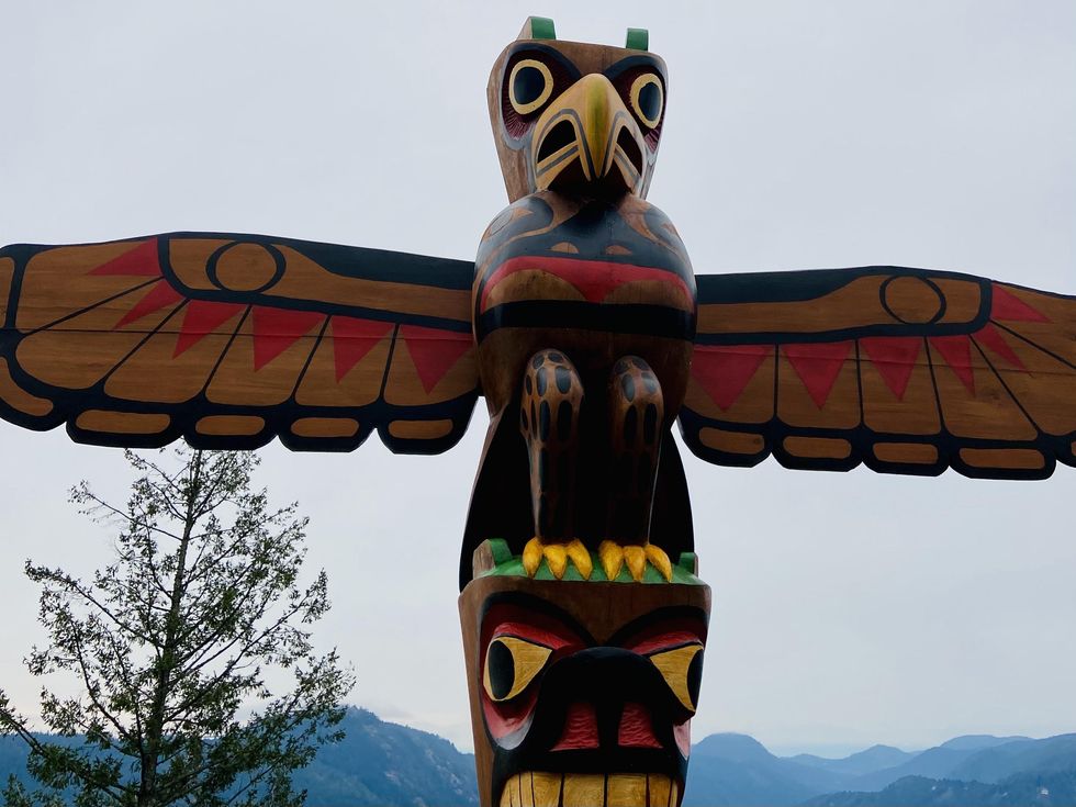 Painted totem pole between Victoria and Tofino, BC.