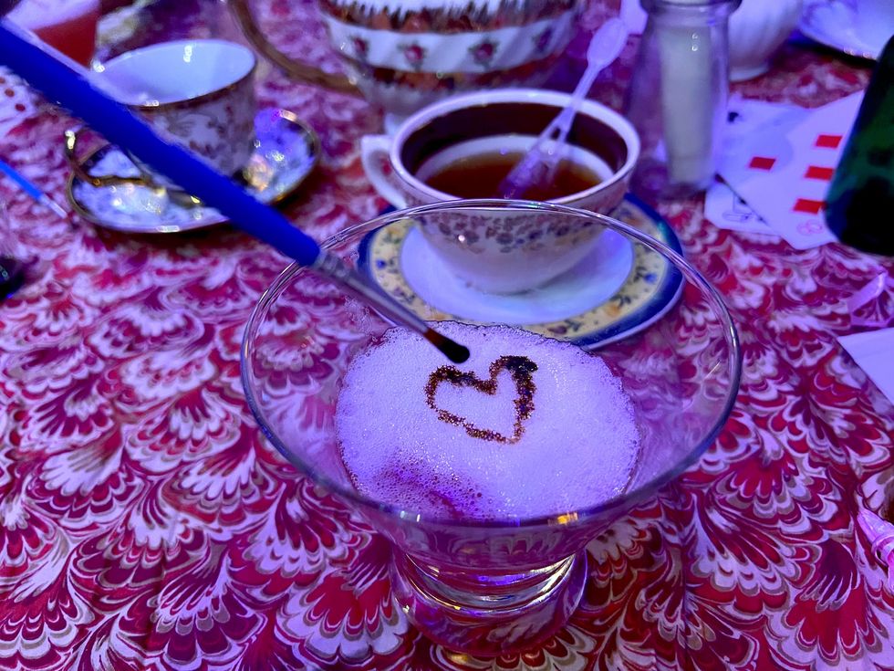 Painting with chocolate on a cocktail.