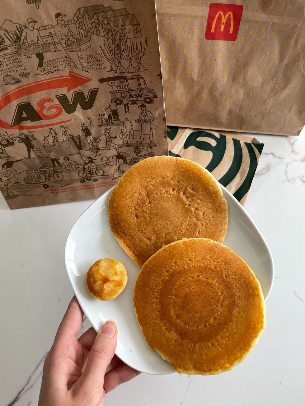 pancakes from starbucjs, mcdonald's and a&w on a plate