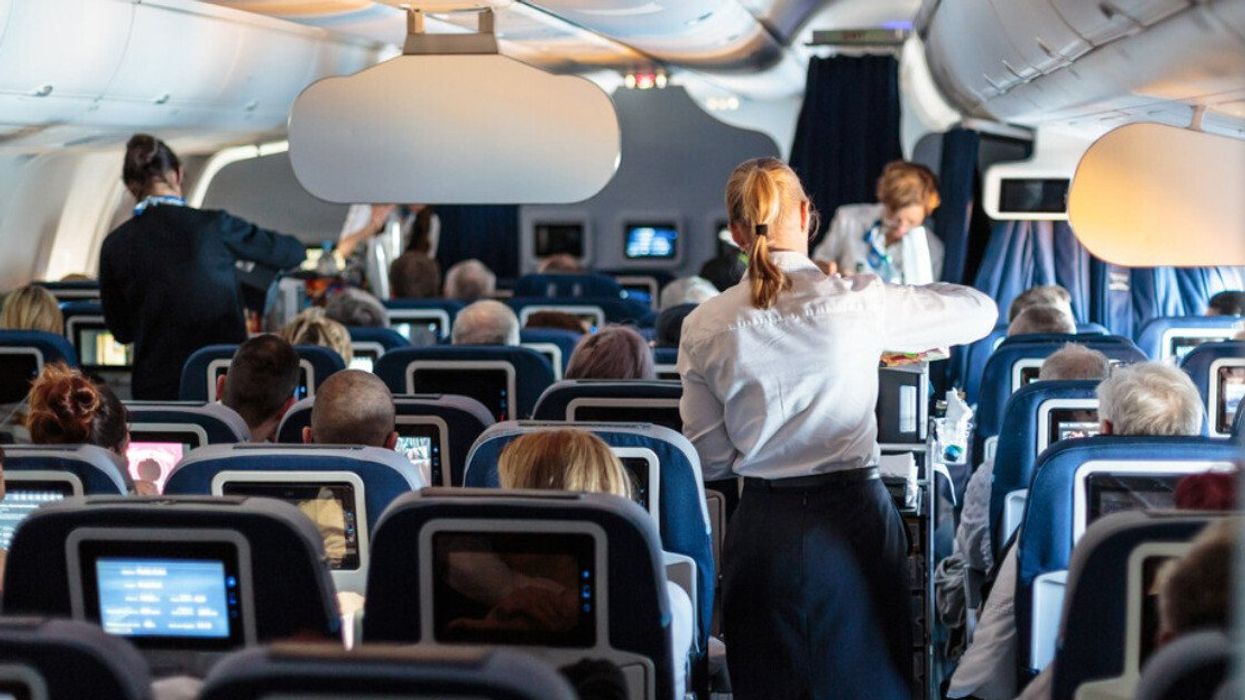 Passengers and flight attendants on a flight.