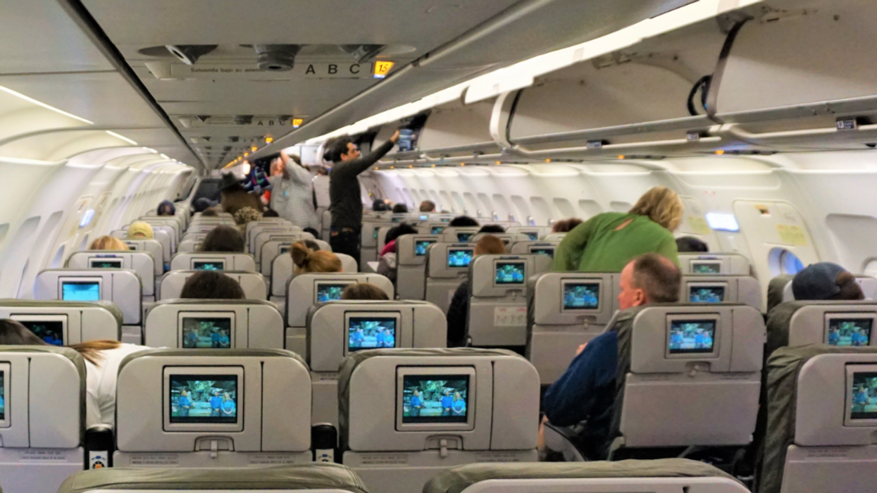 Passengers on an aircraft.