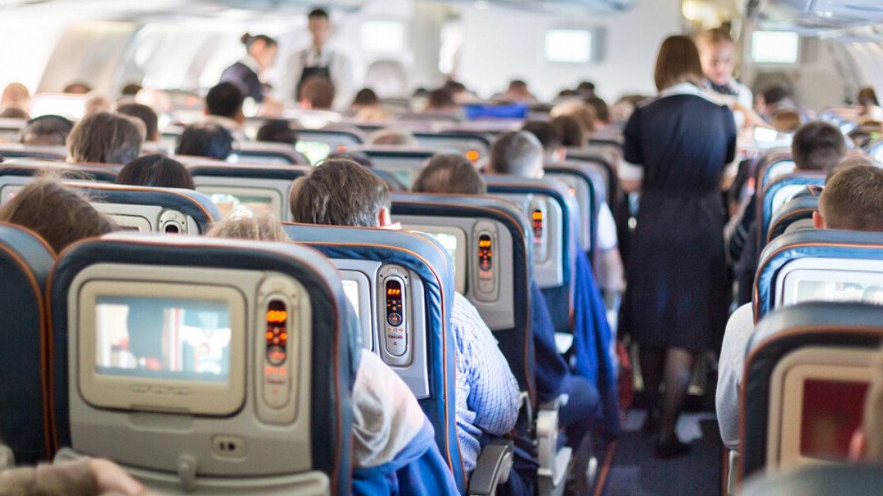 Passengers seated on an airplane.