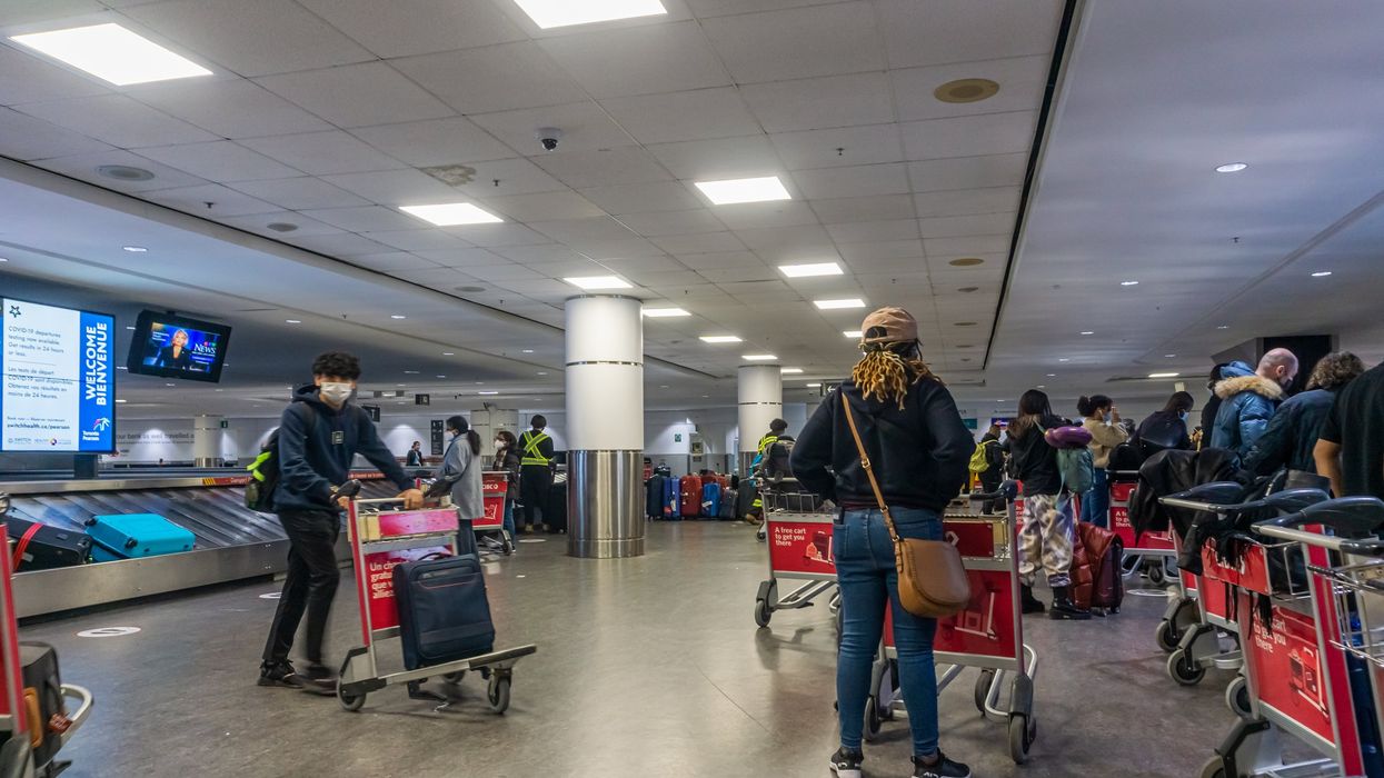 Passengers waiting for their baggage at Toronto Pearson International Airport (YYZ).
