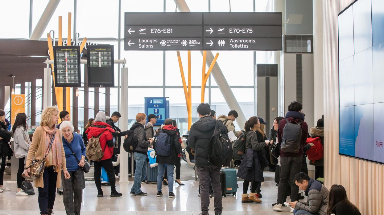 Passengers waiting inside Pearson Airport in 2017.