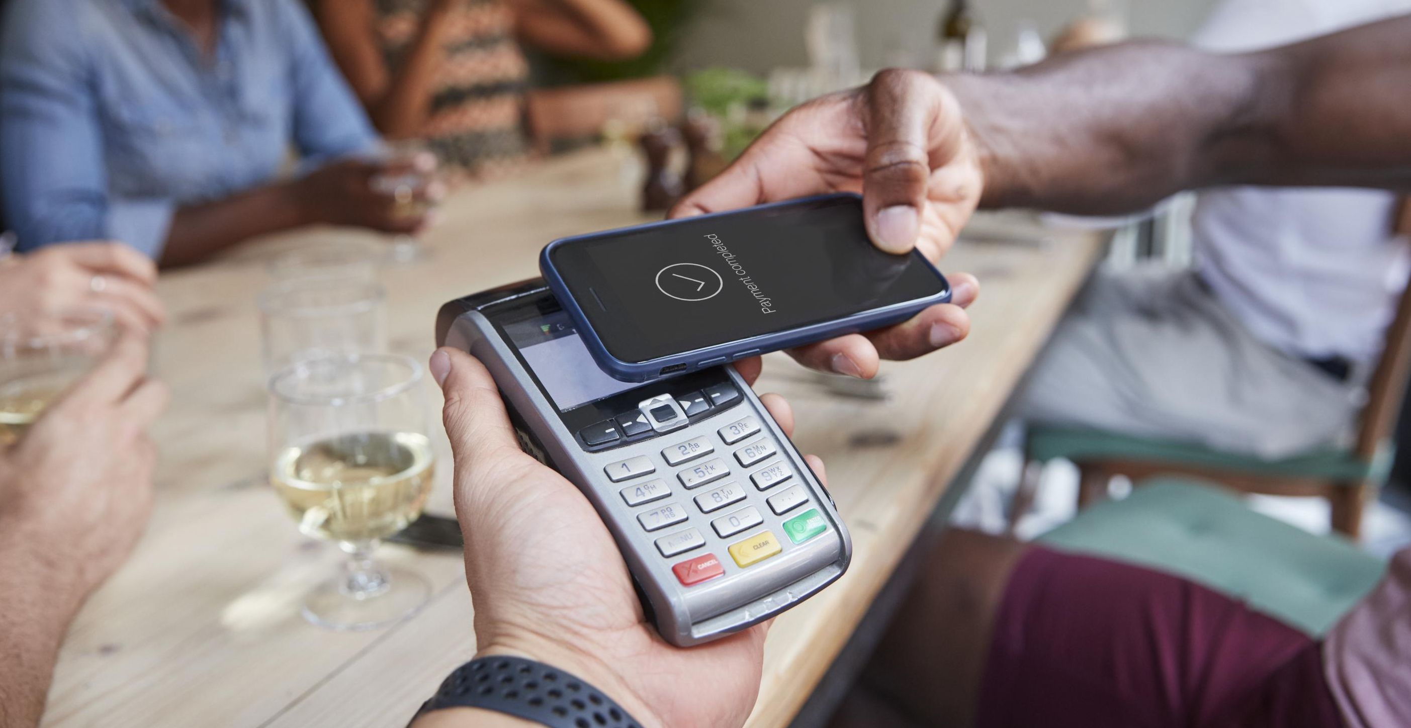 Paying a bill at a restaurant.
