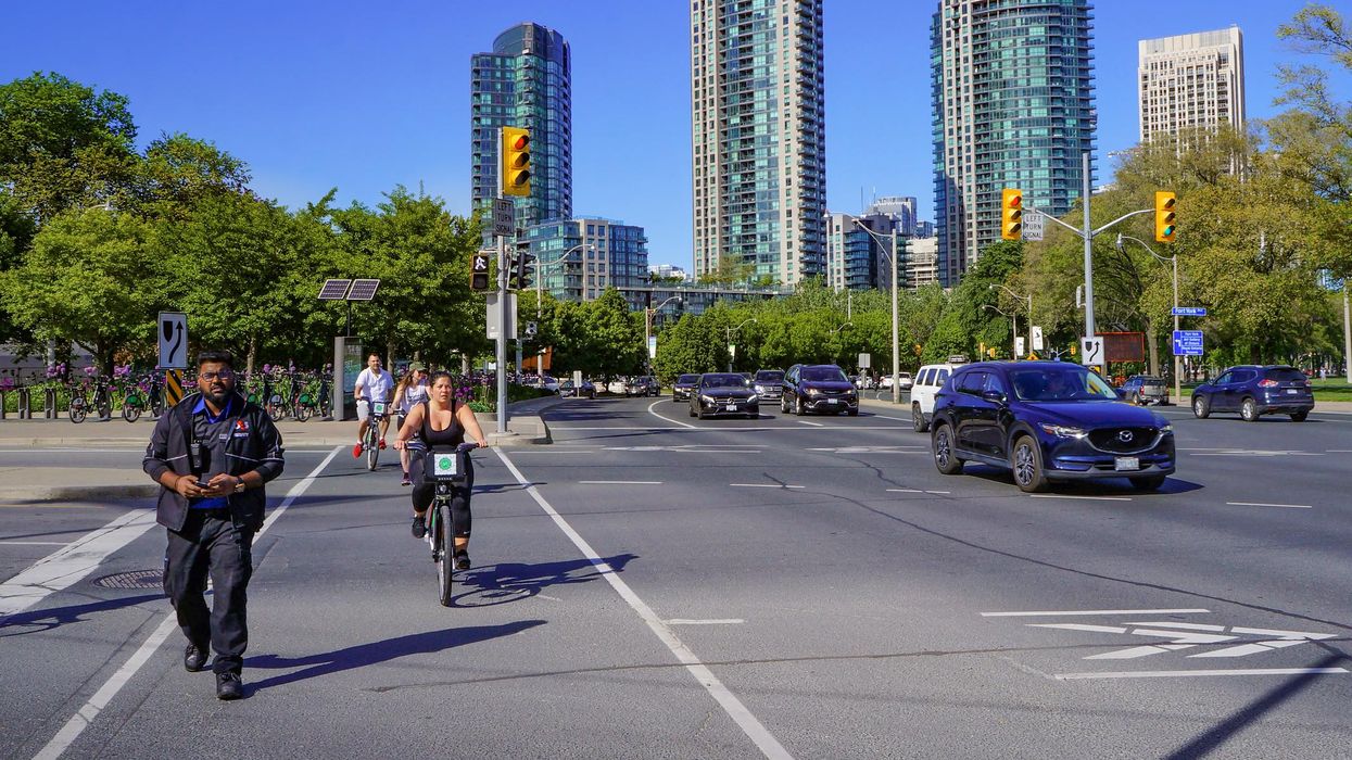 Pedestrians travelling on Lake Shore West.