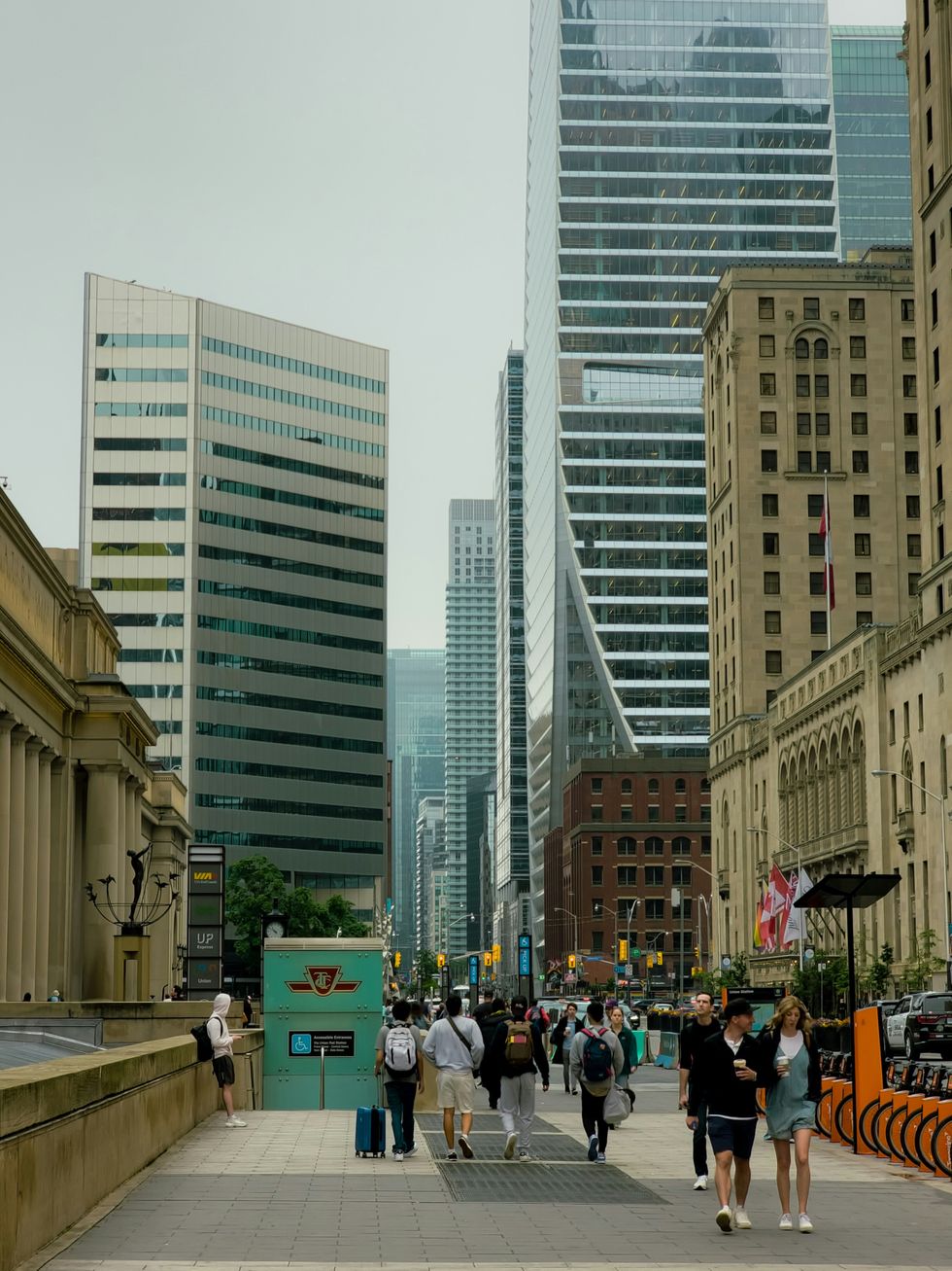 Pedestrians walking by Union Station in Toronto.