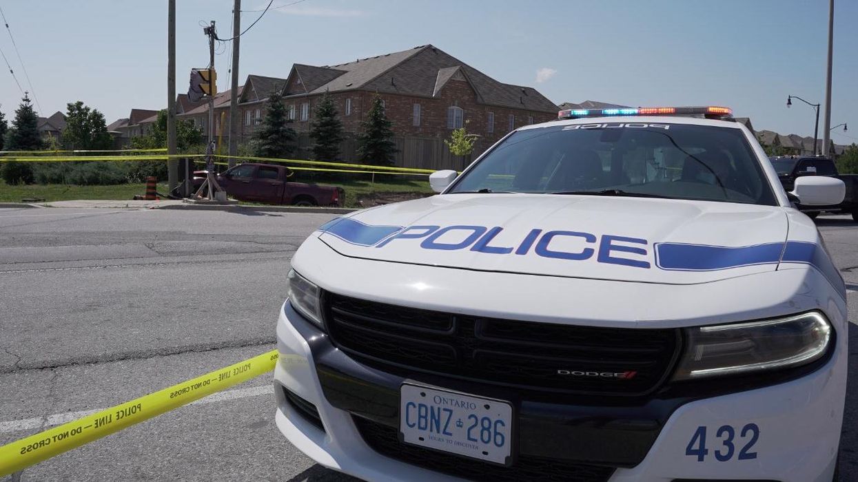 Peel Regional Police car on a road that's been taped off.