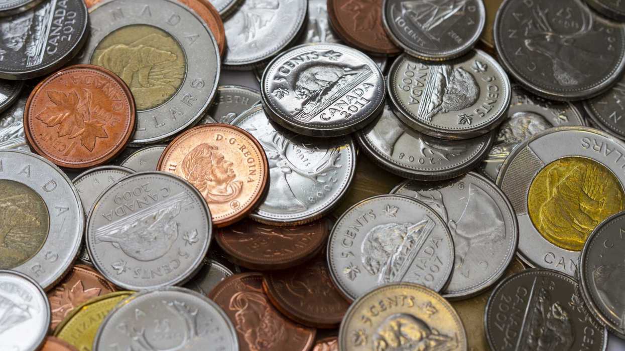 penny in pile of canadian coins