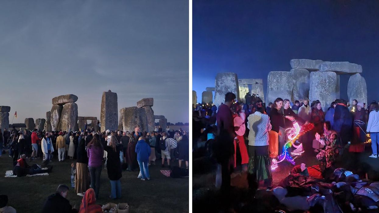 People celebrating the summer solstice at the Stonehenge.