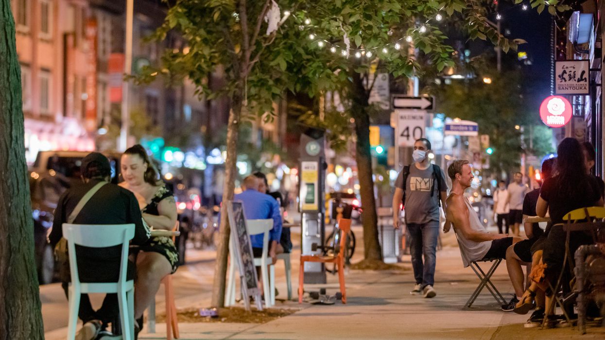 People eating at a restaurant in Toronto.