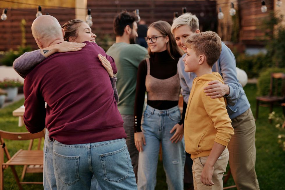 People embracing at a family gathering.