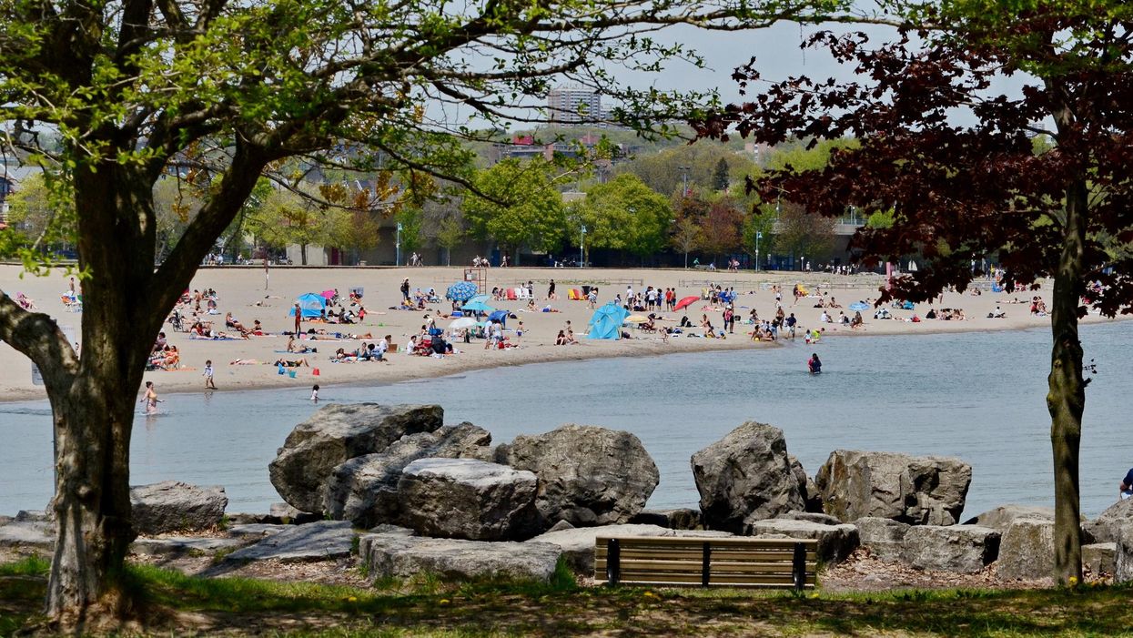 People enjoying the warm weather on Woodbine Beach.