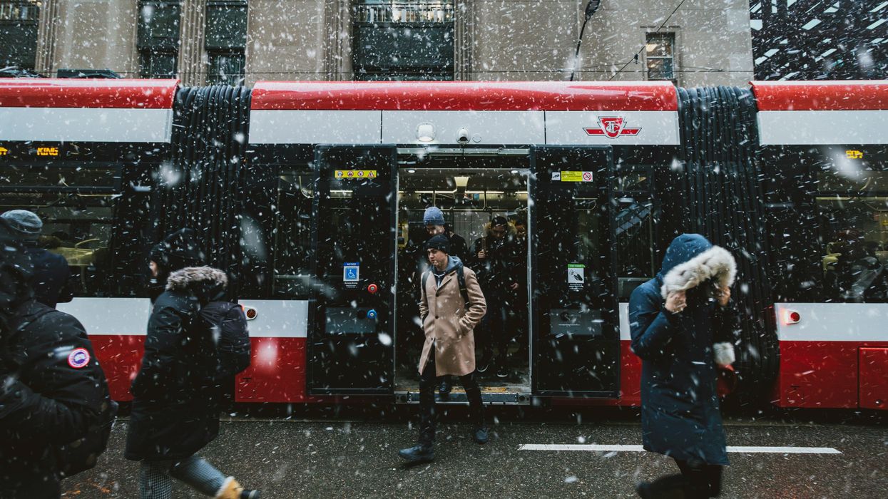 people exiting ttc streetcar in toronto during snow